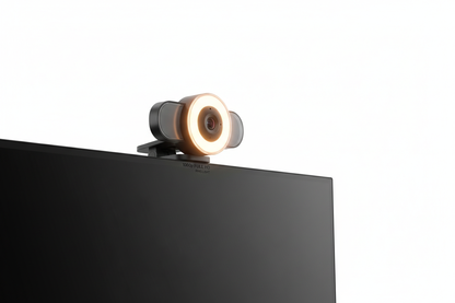1080P webcam with built-in ring light clipped to monitor